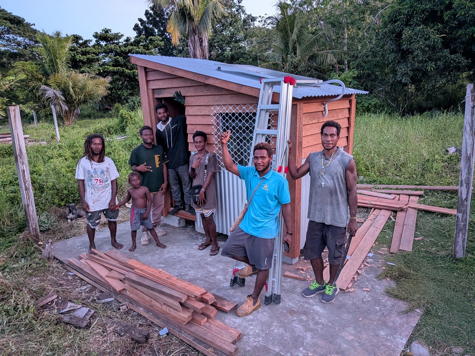A group gathers beside a Powa Haus