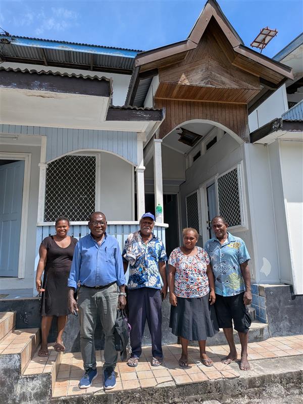 Five SIAVRTC team members outside their building